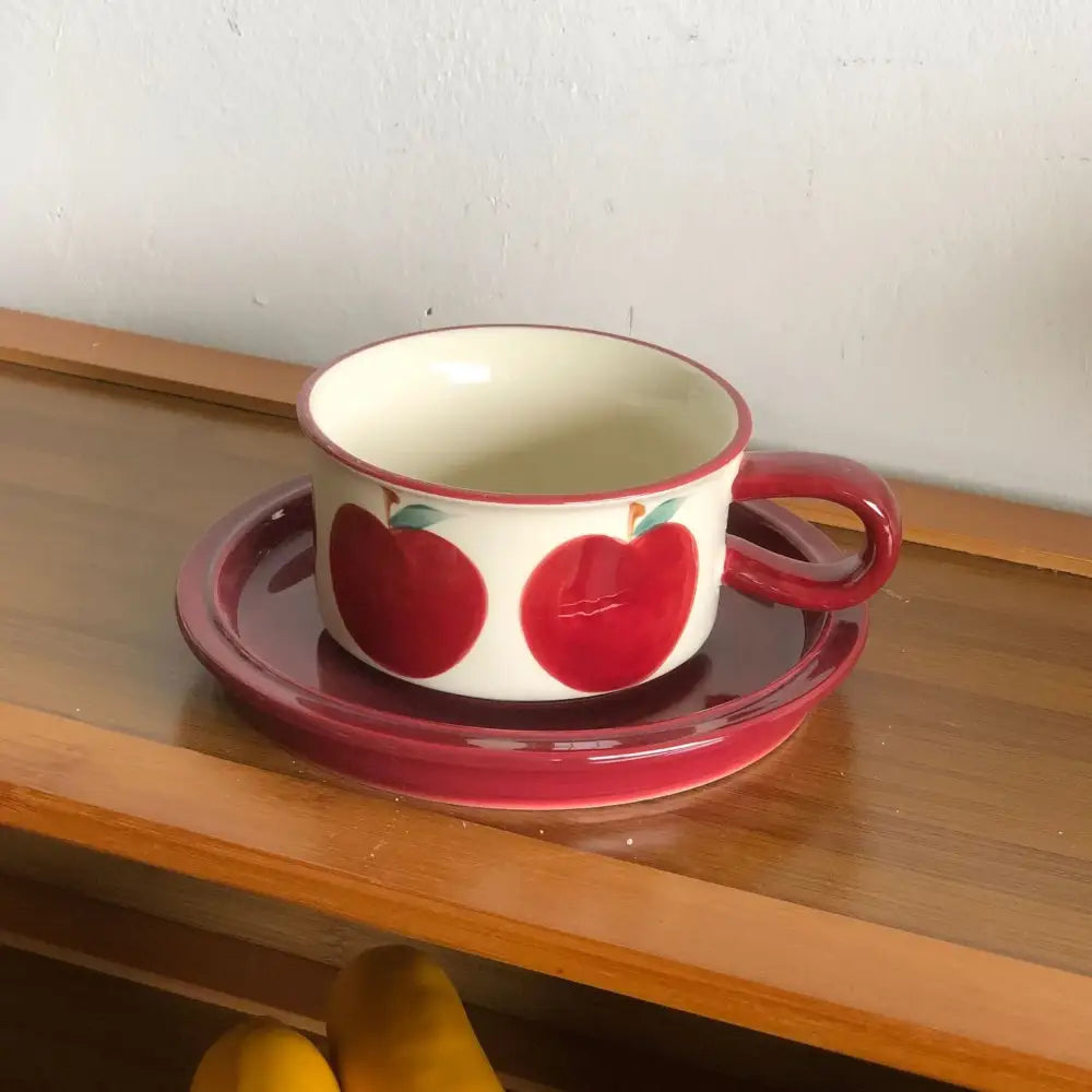 White ceramic teacup with red apple fruits pattern porcelain and matching red saucer from decorbites pattern porcelain coffee set