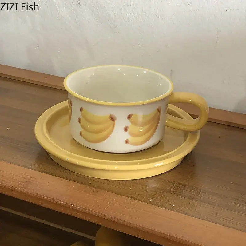 Yellow ceramic banana-themed cup and saucer set featuring decorbites fruits pattern porcelain for dining room use