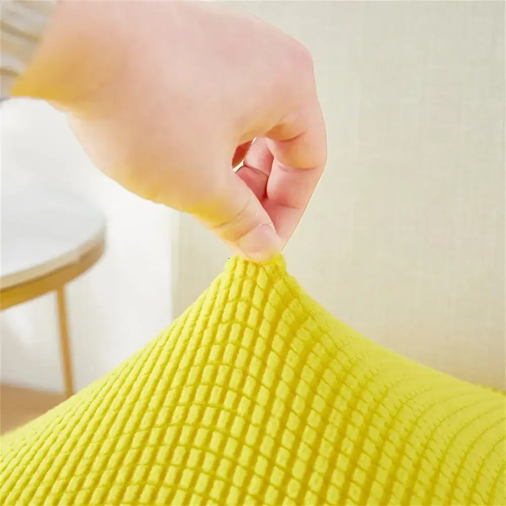 Yellow ribbed fleece chair cover made of stretchy fabric with textured grid pattern for dining room seat protection