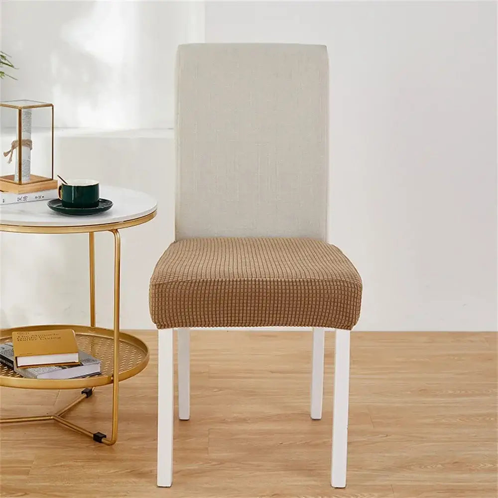 Beige and tan stretchy fleece chair cover with textured grid pattern for dining room seat protection chair covers