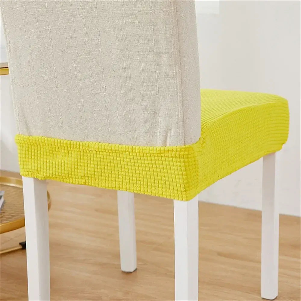 Bright yellow ribbed fleece chair cover with contrasting beige fabric backrest for dining room seat protection