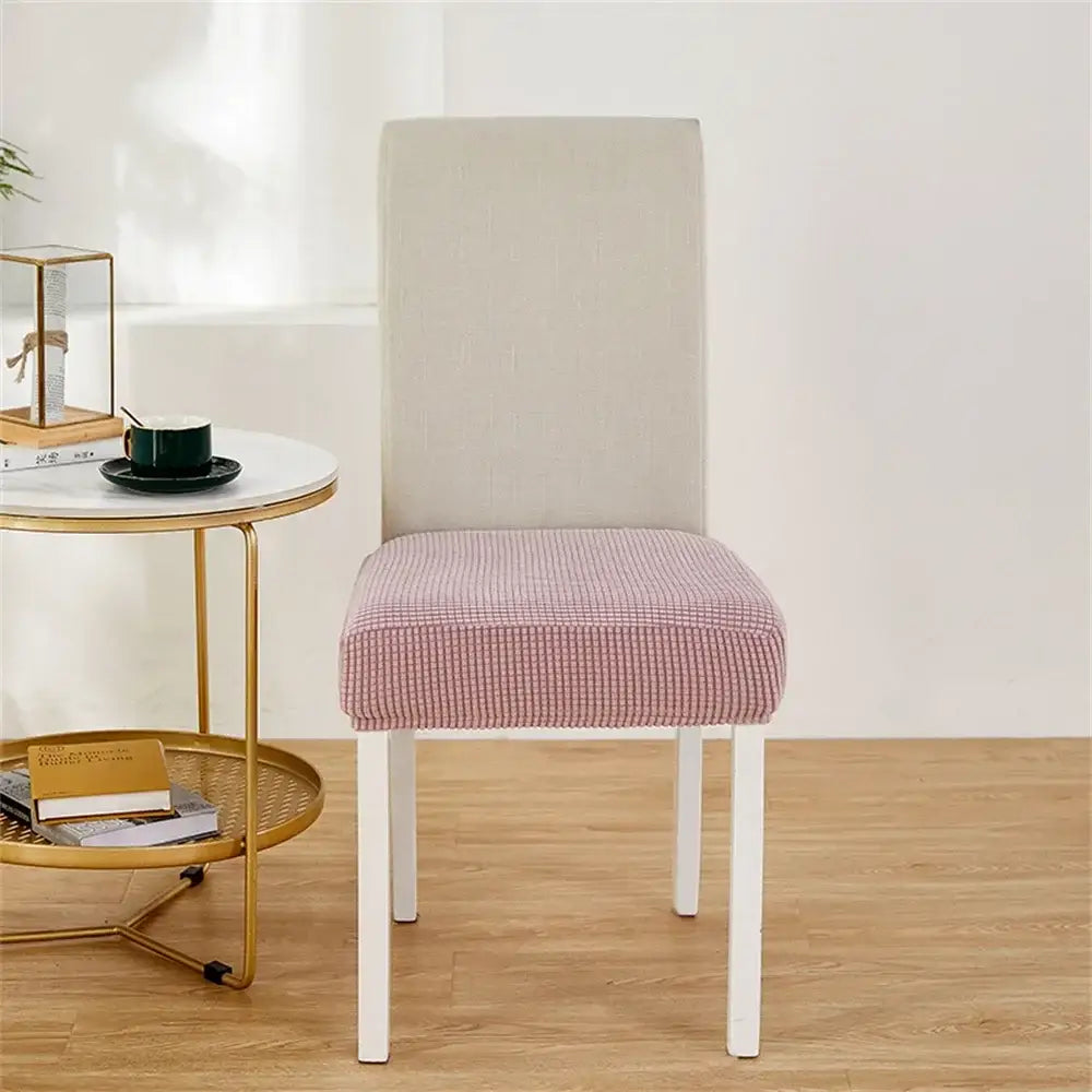 Yellow ribbed fleece chair cover in pink and white checkered pattern snugly fits modern dining chair for seat protection