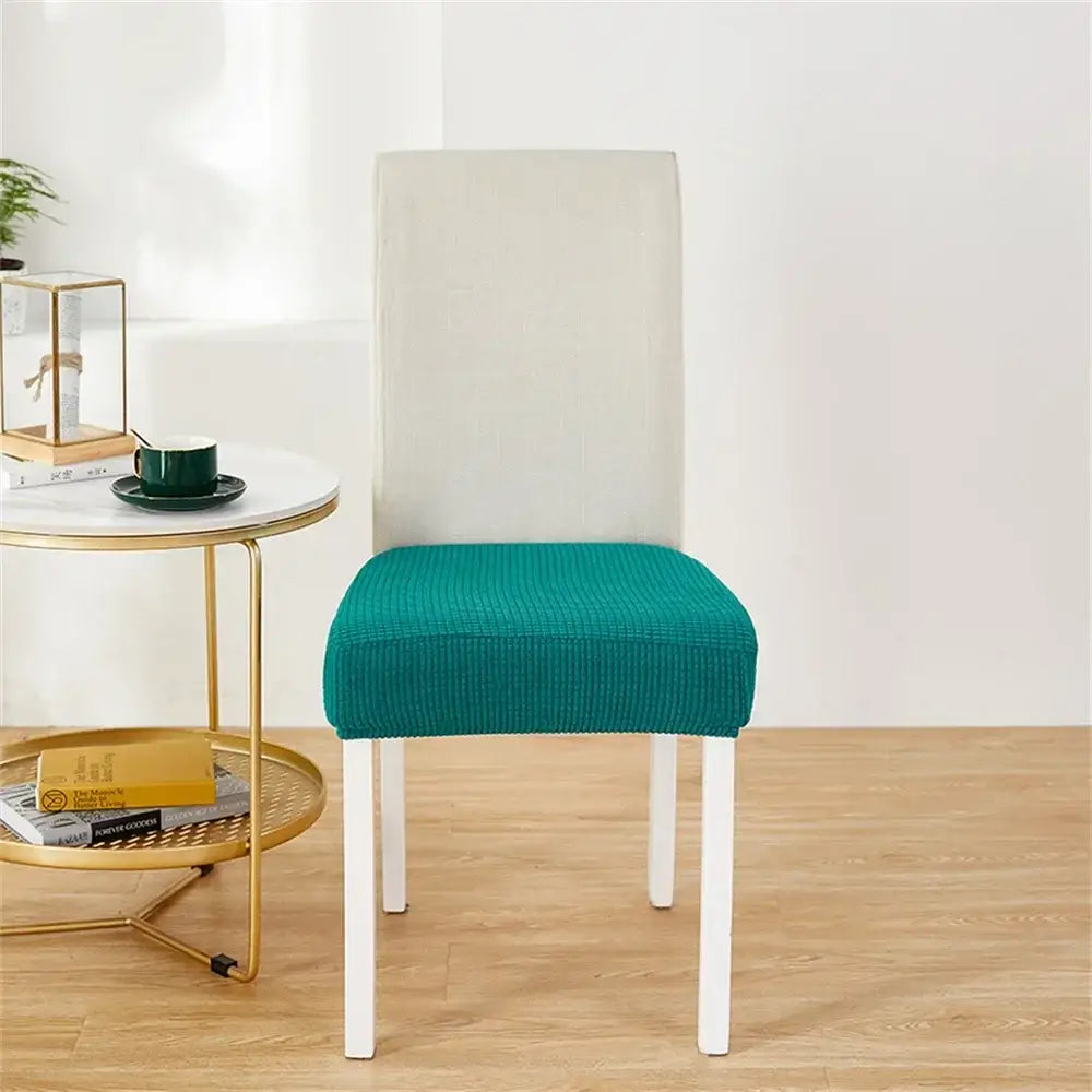 Teal ribbed stretch chair cover over white dining chair offering fleece chair cover protection for seats