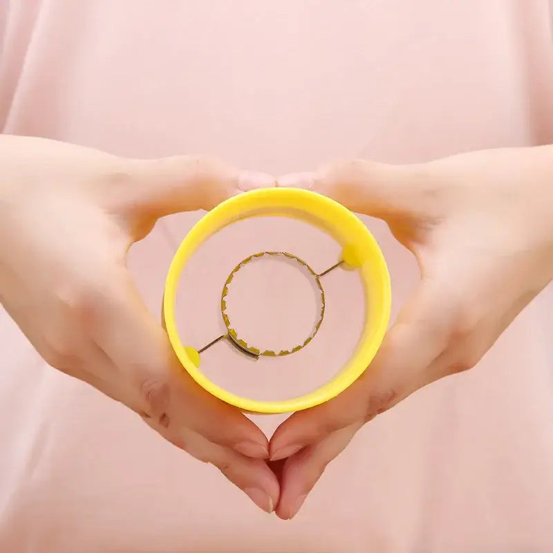 Yellow plastic circular corn peeler tool with metal scalloped ring for textured grip kernel removal by decorbites corn peeler