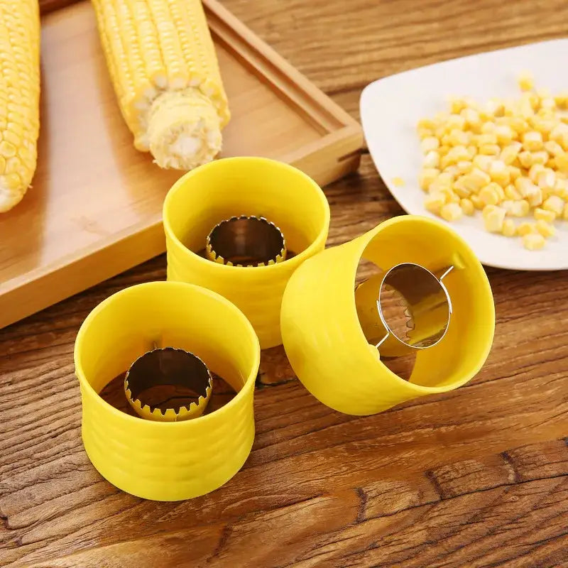 Bright yellow decorbites corn peeler tool with metallic serrated blades and textured grip for easy kernel removal