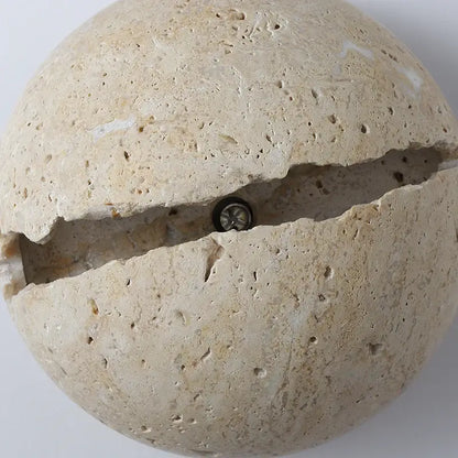 Beige yellow travertine dino egg stone wall lamp with split design and embedded bulb decorbites dino egg sconce