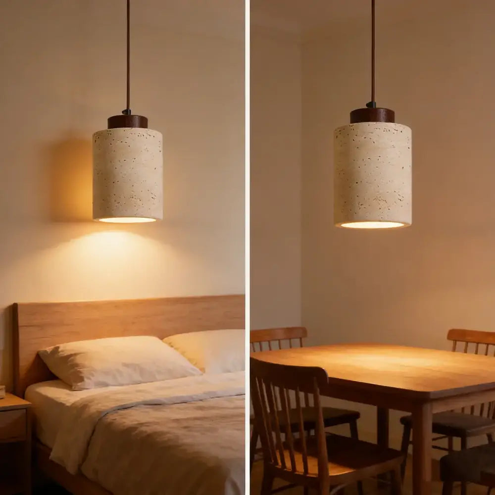 Beige cylindrical pendant light with speckled concrete texture and dark metal hardware for kitchen stone pendant light