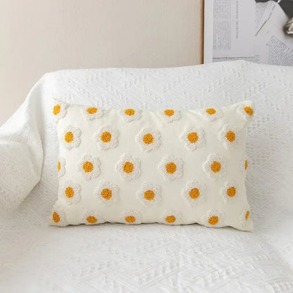 Cream-colored rectangular pillow cover with raised yellow and white daisy embroidered flora cotton design for bedroom sham
