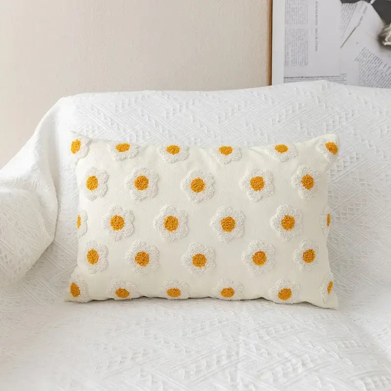 Cream-colored rectangular pillow cover with raised yellow and white daisy embroidered flora cotton design for bedroom sham