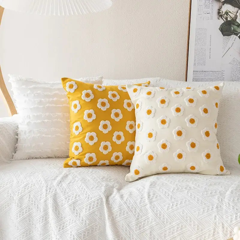 Two embroidered flora cotton pillow covers in yellow and white with floral appliqué for bedroom decor