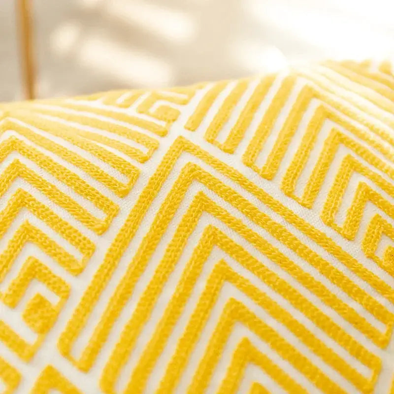 A vibrant yellow and white geometric embroidery canvas cushion cover with textured decorbites geometric embroidery design