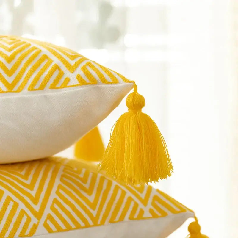 Yellow and white geometric embroidery canvas cushion cover with yellow tassels for living room decorbites geometric embroidery
