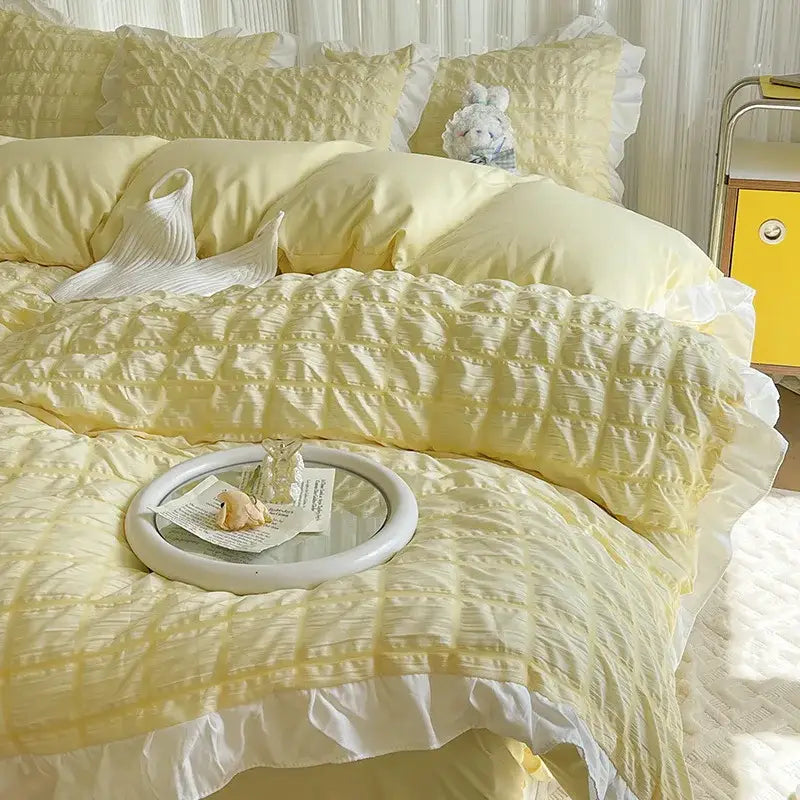Yellow and white ruffled bubble gauze duvet cover set with soft pale yellow quilted fabric and matching pillows