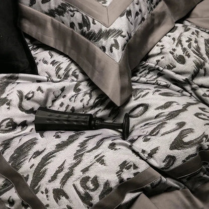 Black textured pump on gray and black patterned bedspread of zebra print decorbites 1000tc egyptian cotton bedding set
