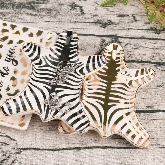 Zebra print ceramic jewelry holder tray with gold tiger skin pattern and gold-trimmed edges for bedroom decor