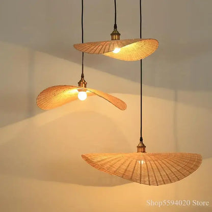 Three bamboo zen tea pendant lights with fan-shaped woven shades and brass fixtures for a tea room chandelier