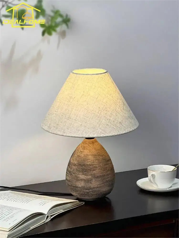 Rustic teardrop-shaped decorbites ceramic jar led table lamp with textured brown base and beige linen shade for living room decor