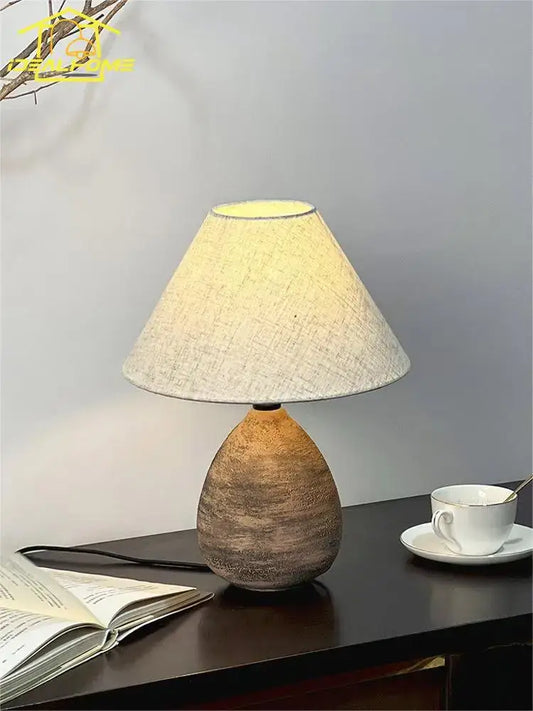 Earthy-toned decorbites ceramic jar led table lamp with textured teardrop base and beige linen shade for living room decor