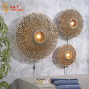 Three circular bamboo weaving wall lamps with warm glowing bulbs for living room zen natural wall lamp decor