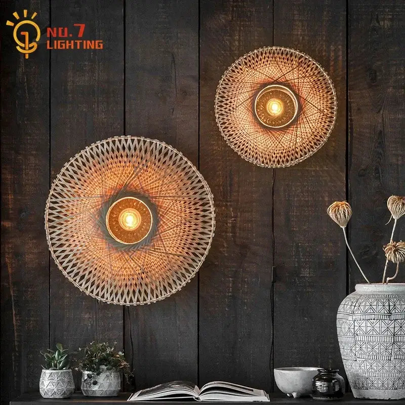 Two circular woven wall lamps with warm glowing lights and natural bamboo weaving for living room decor