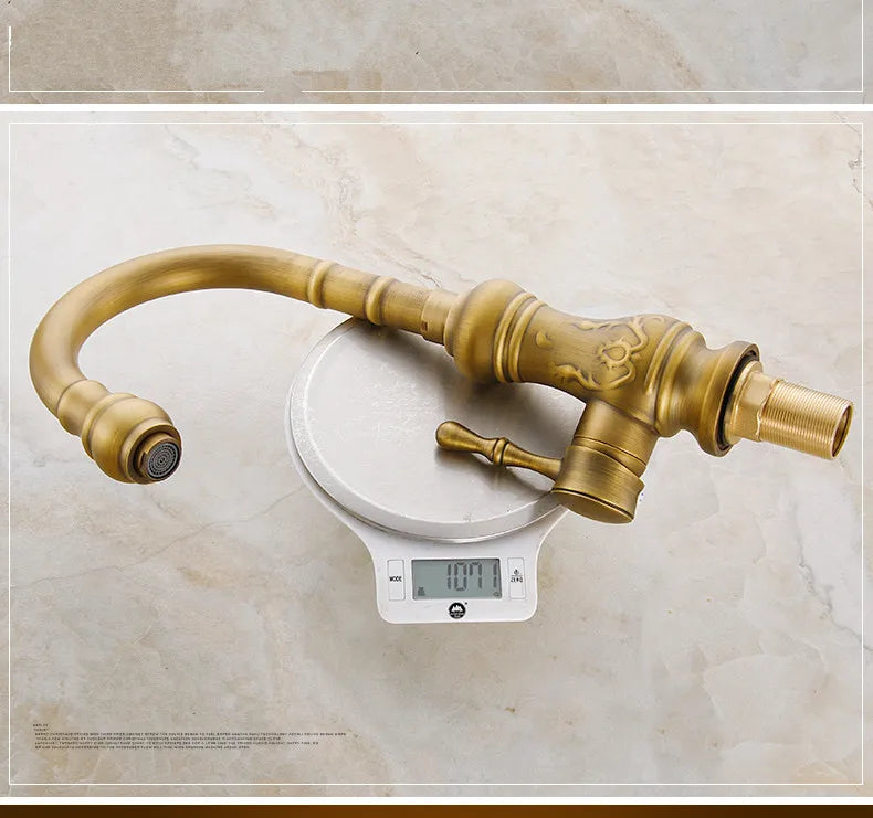 Antique brass kitchen mixer tap with ornate scrollwork single hole deck mounted housing material durable
