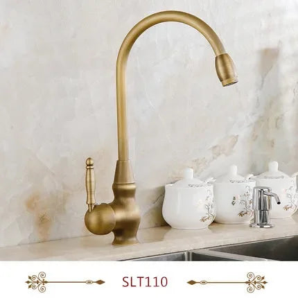 Antique brass deck mounted single hole kitchen faucet with curved spout and ornate handle housing material metal