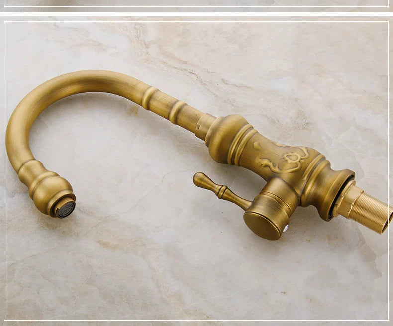 Antique brass kitchen mixer tap with single hole deck mounted design and ornate detailing for vessel sinks