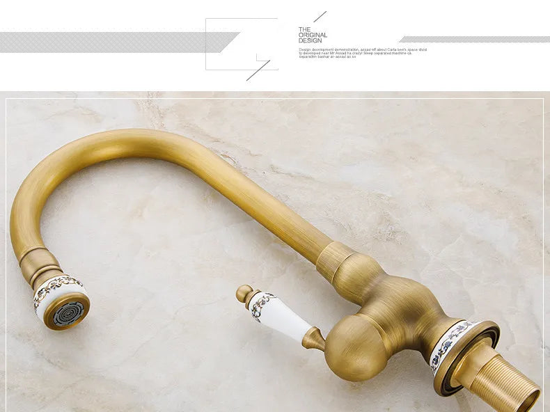 Antique brass deck mounted kitchen faucet with ornate white ceramic handles and blue floral detailing for single hole sinks